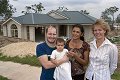 New South Wales homeowners Mark Nock and Claudia Varas, pictured with their daughter Jade in front of their partially completed new home, won an $8000 home entertainment package from BHP Steel by choosing roofing made from COLORBOND® steel for their home. Diane Bass from BHP Steel (right) congratulates the Warnervale couple on their win.