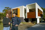 M & J Green Builders' Mark Green (left) with BHP Steel representative Ken Clark, pictured in front of an award-winning M & J Green-built home which makes extensive use of COLORBOND® steel. M & J Green Builders has won an $8000 home entertainment package from BHP Steel by selling roofing made from COLORBOND® steel.