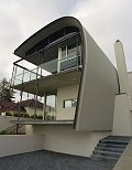 This award winning beach home in Cottesloe, Western Australia, features an eye-catching curved roof - made from COLORBOND steel in the colour Surfmist - which bends around to also serve as the southern wall of the home.